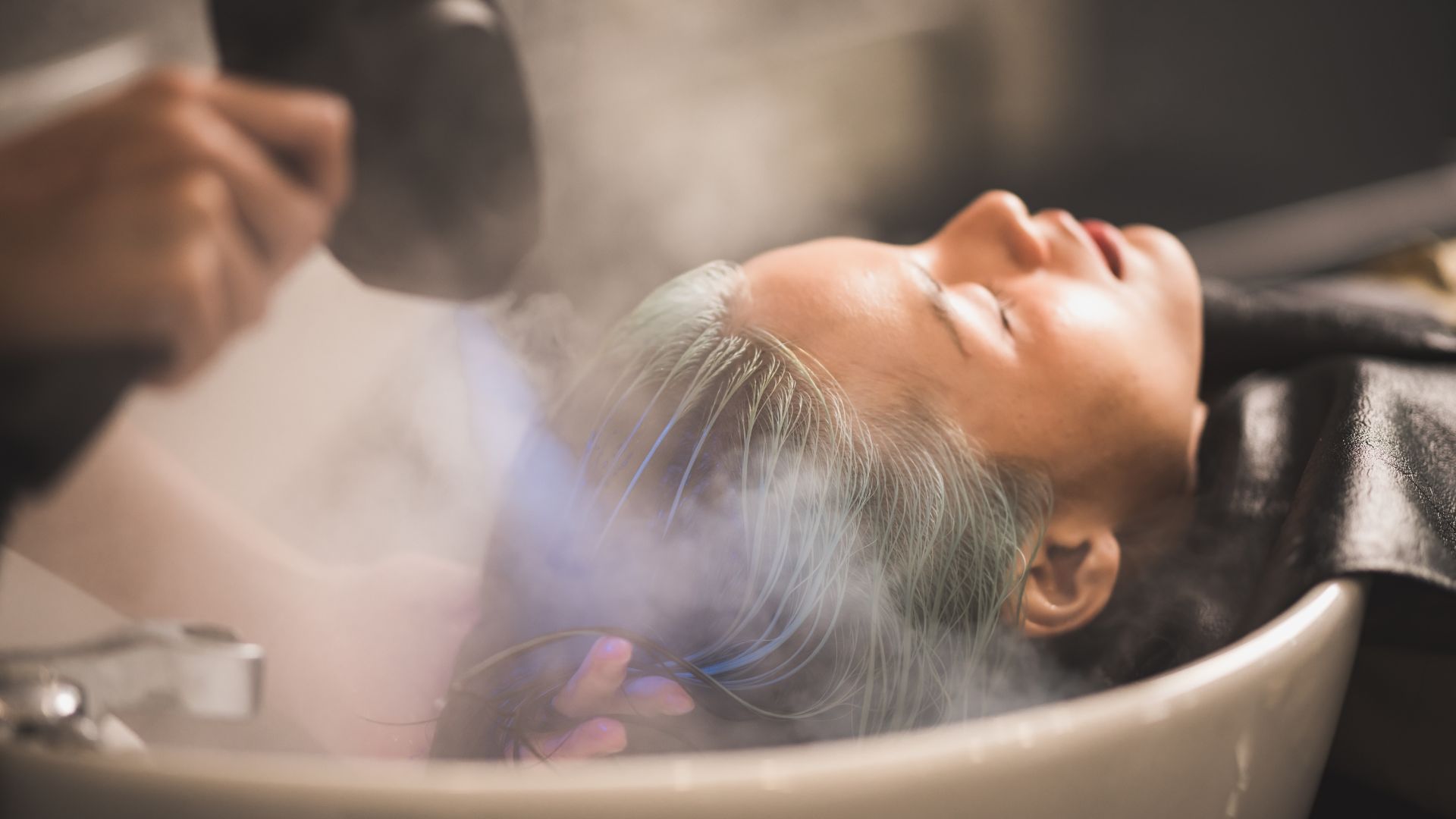 Client receiving a luxury spa mist scalp treatment